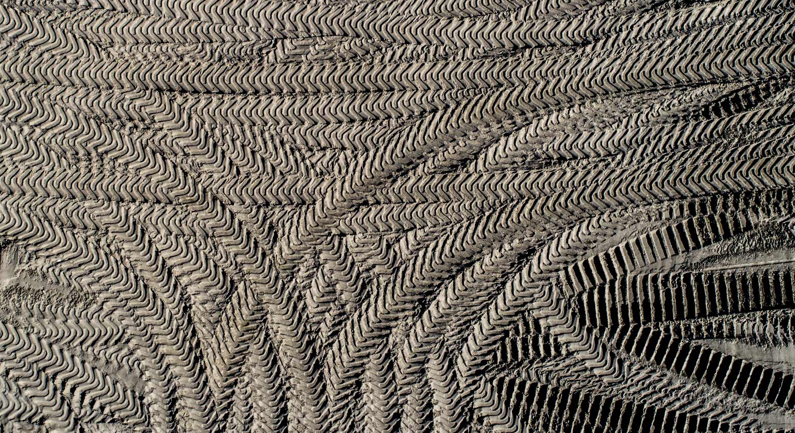 Shape of sand modeled by wind lit by the midnight sun, Refviksanden Beach, Maloy, Vagsoy island, Sogn og Fjordane county, Norway