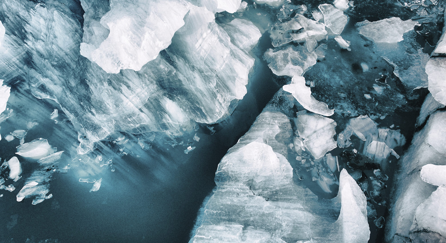 Small icebergs broken off from the large glacier at Vatnajökull, Iceland. Image was taken with a drone.