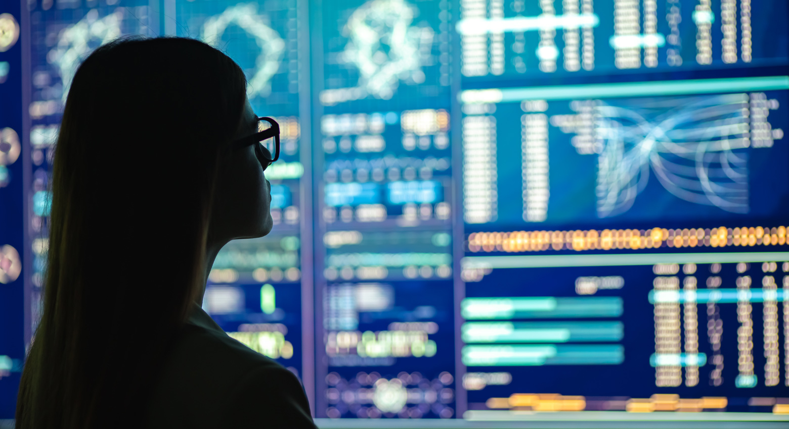 Woman with glasses at computer screen 