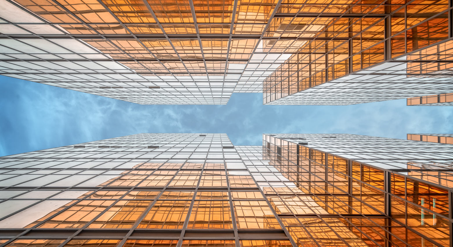 Directly below view of modern golden architecture in Hong Kong, China