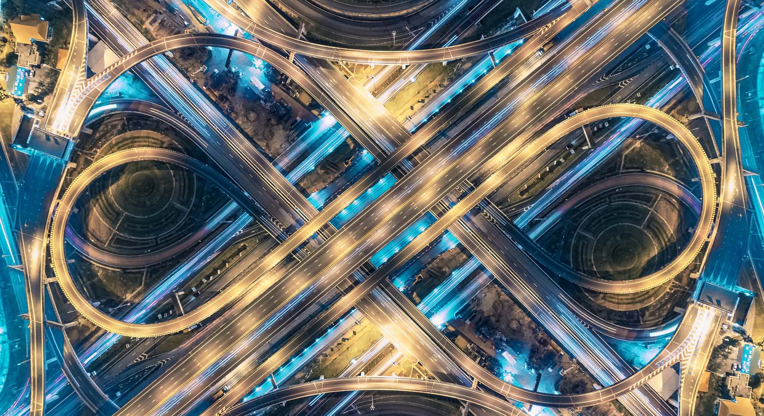 Road beautiful Aerial View of Busy Intersection at Night , top view , Thailand .