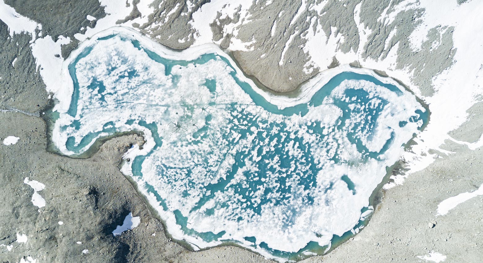 Aerial view of  Lej Lagrev during the thaw, St. Moritz, Engadine, canton of Graubünden, Switzerland, Europe