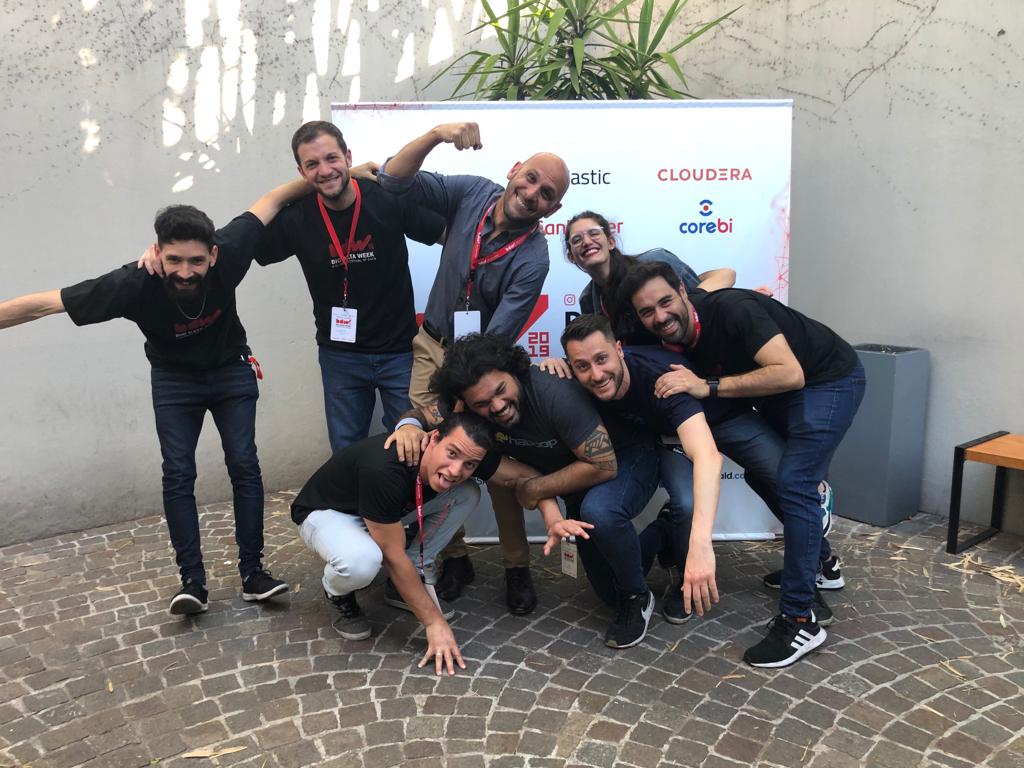 People posing in a huddle